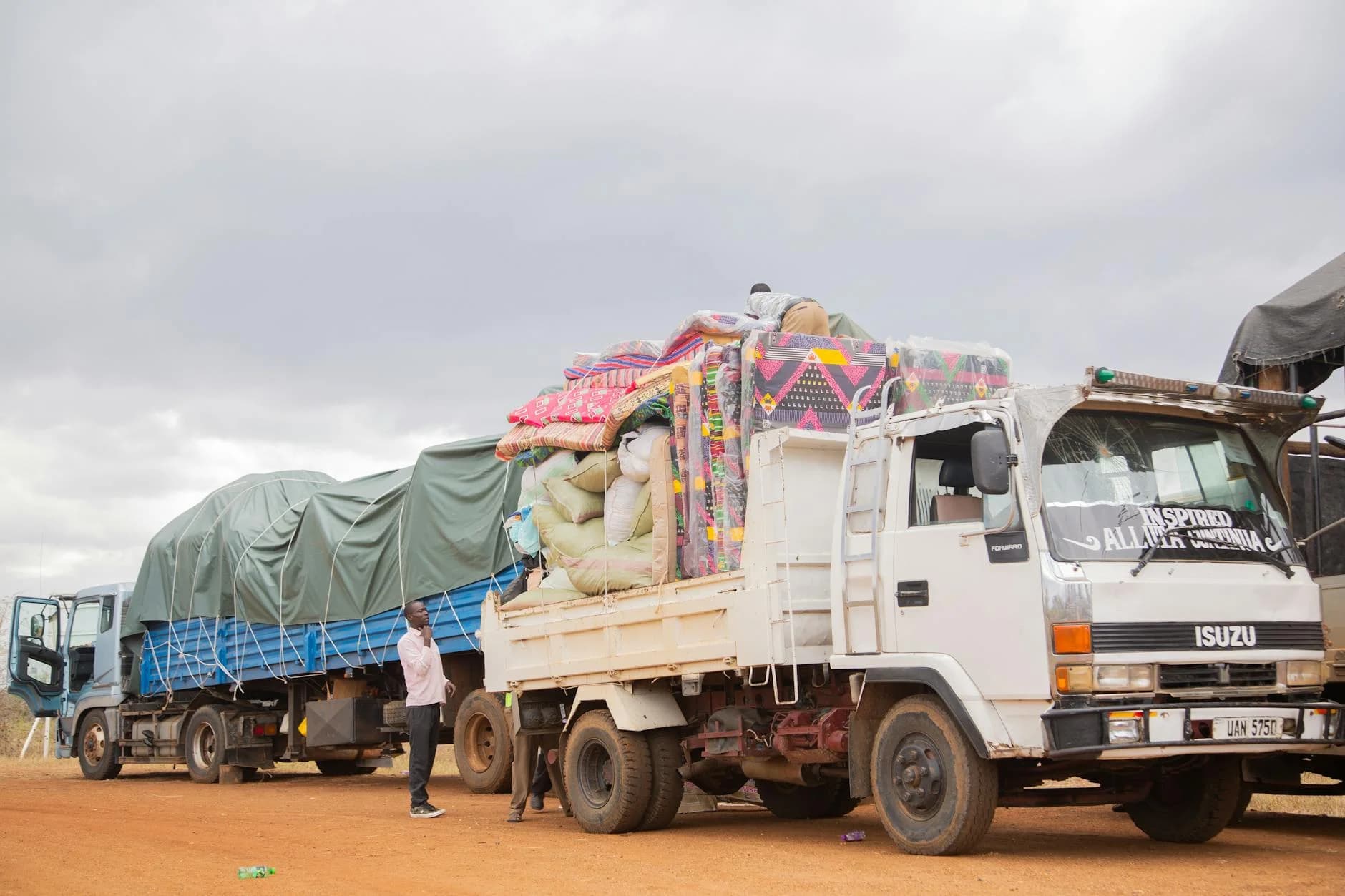 Trucks Loaded With Goods Parked On A Dir 4