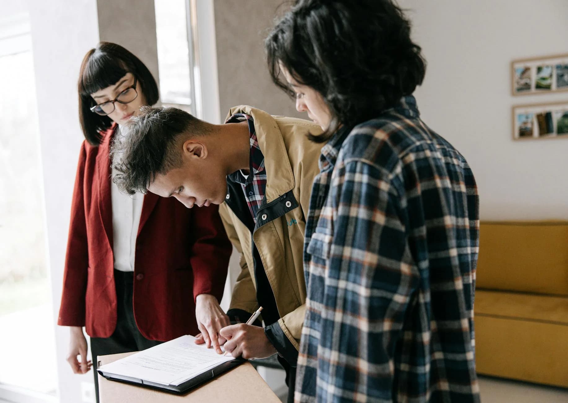 Young Couple Signing A Real Estate Agree 3