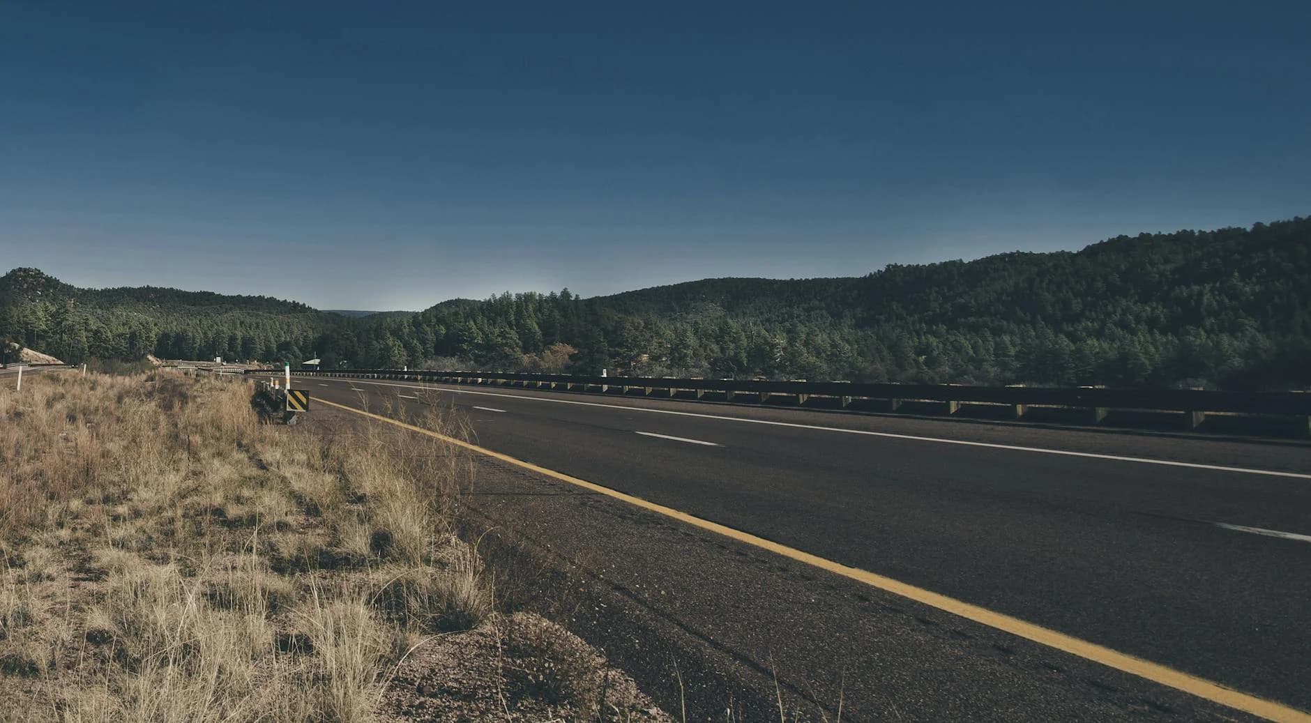A Highway Winding Through Lush Forested 1