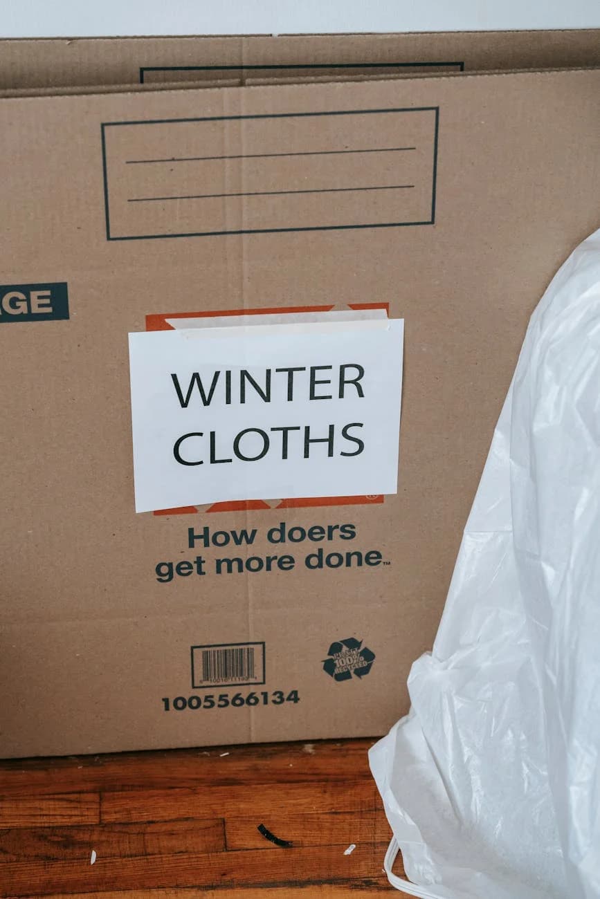 A Cardboard Box Labeled With Winter Clot 2