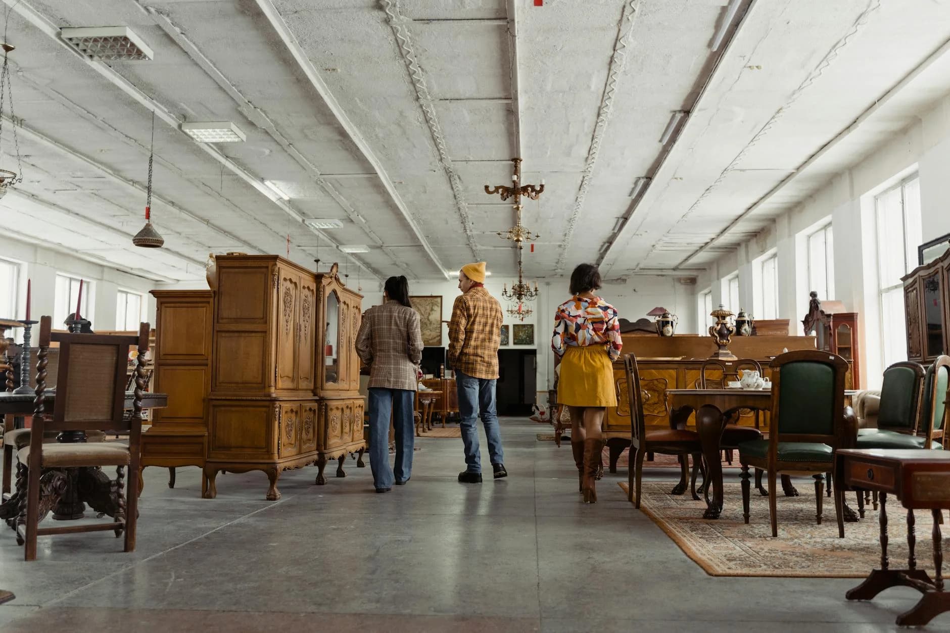 Three People Browsing Vintage Wooden Fur 2