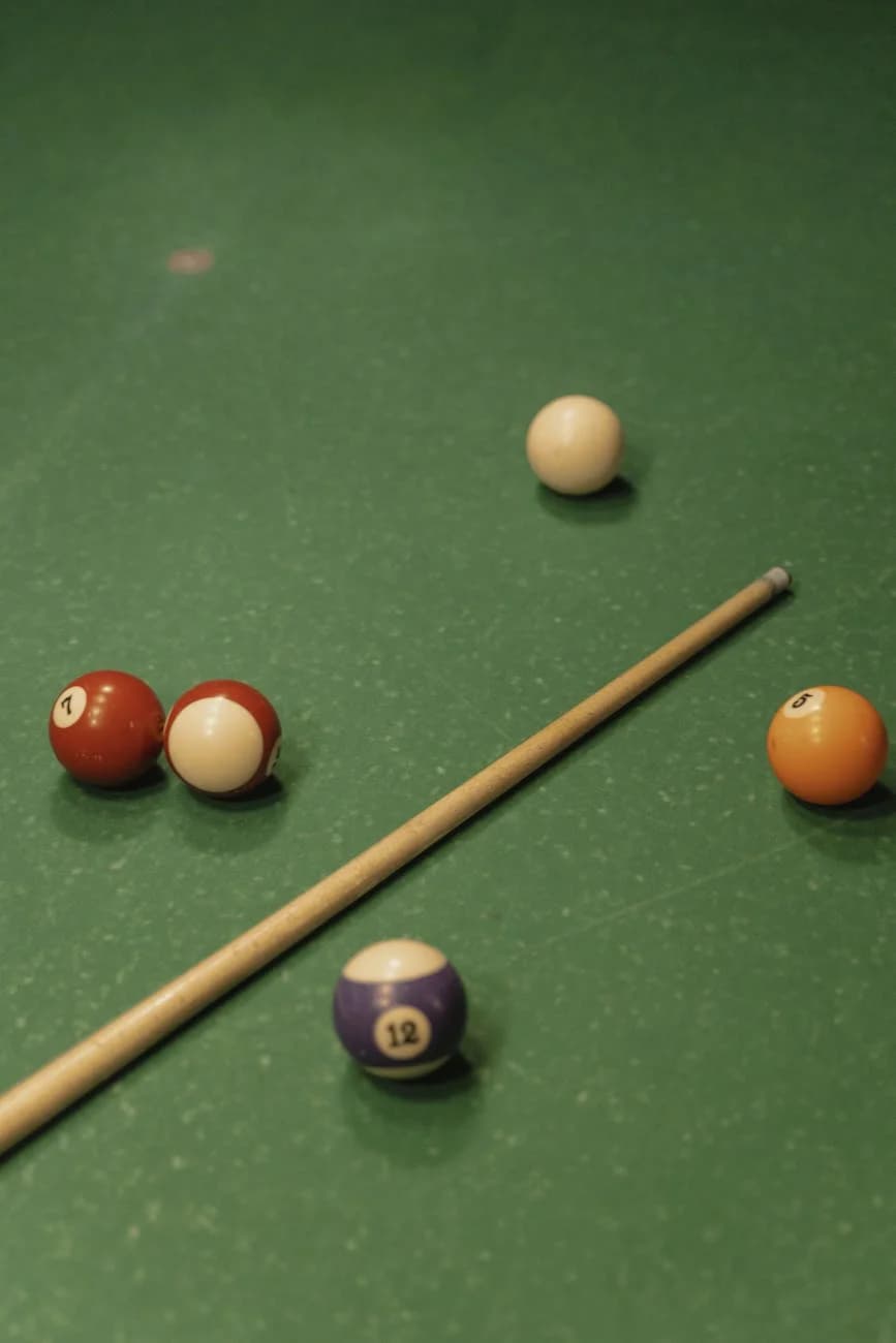 Close Up Of Billiard Balls And Cue Stick 4