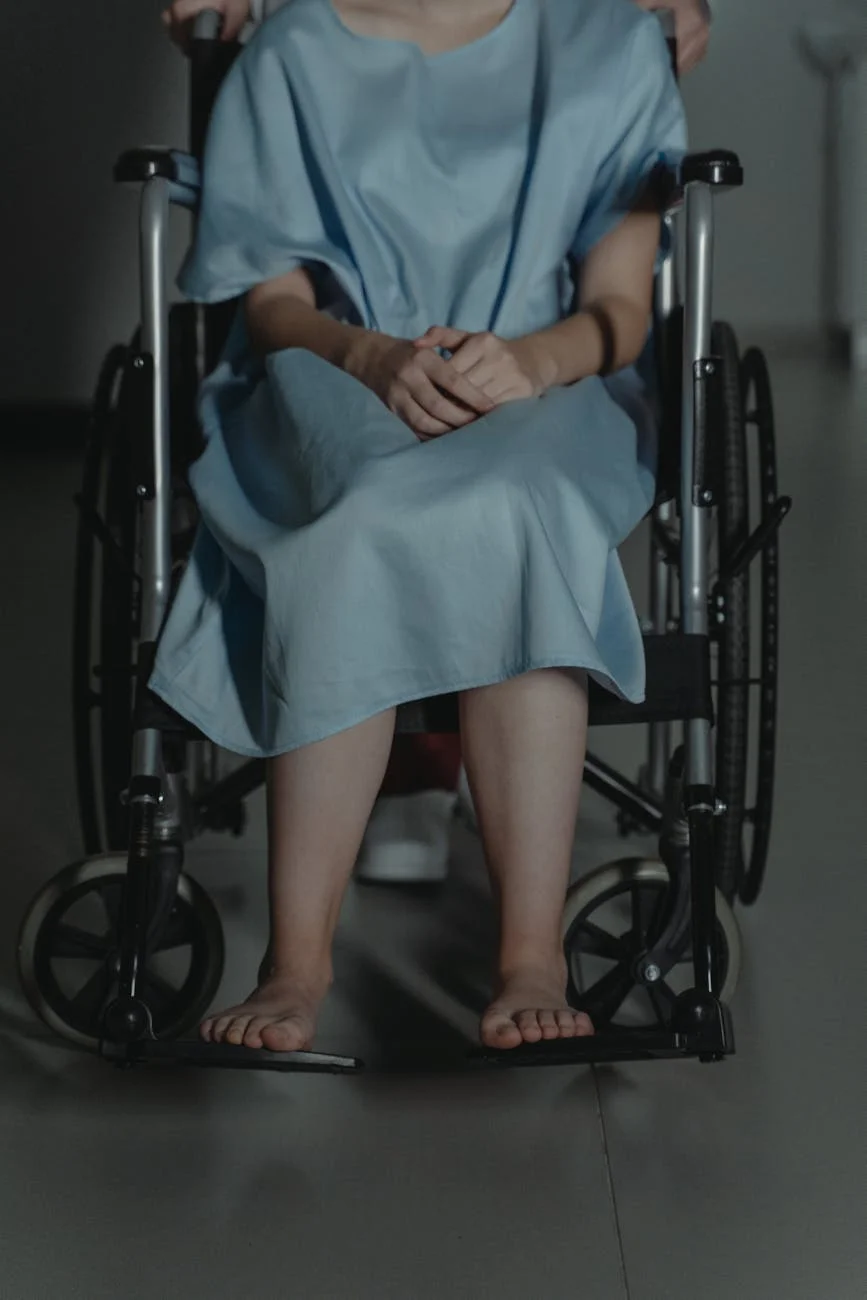 A Young Adult Wearing A Hospital Gown Si 2