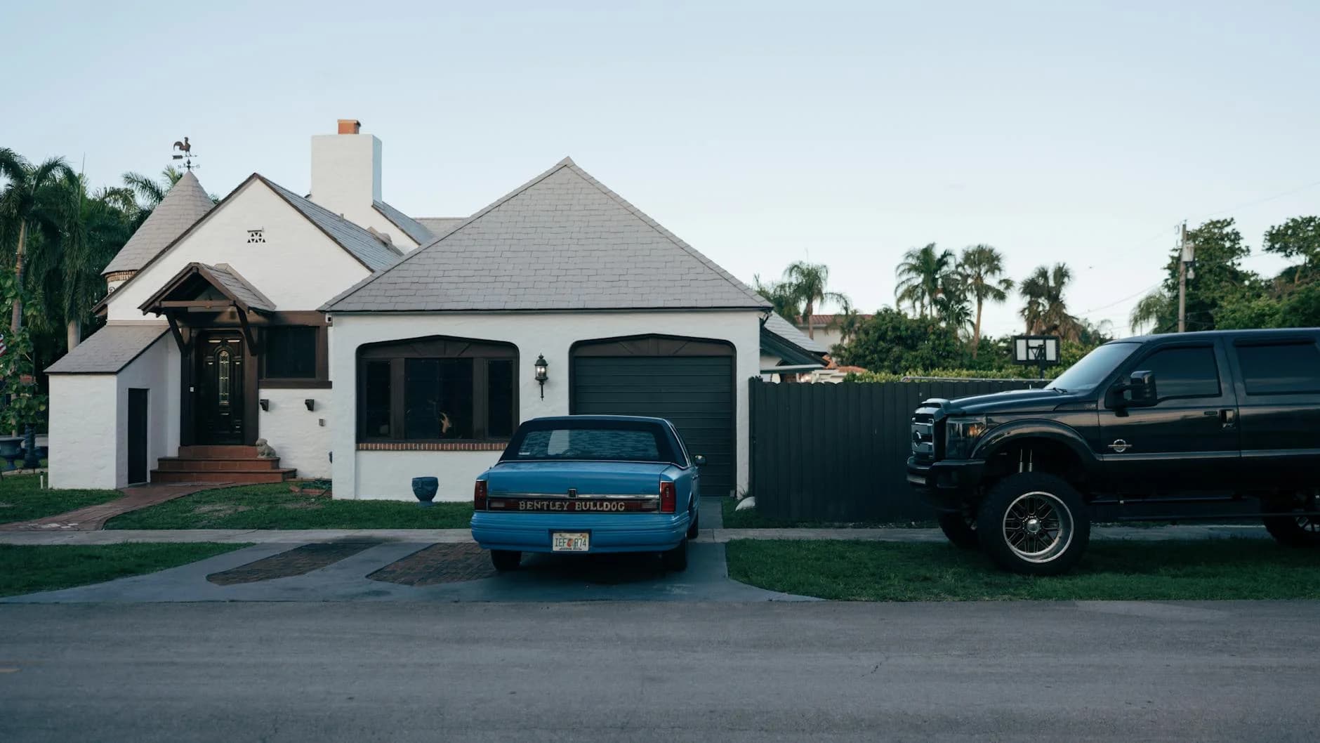 A Suburban House With Parked Classic Ben 3