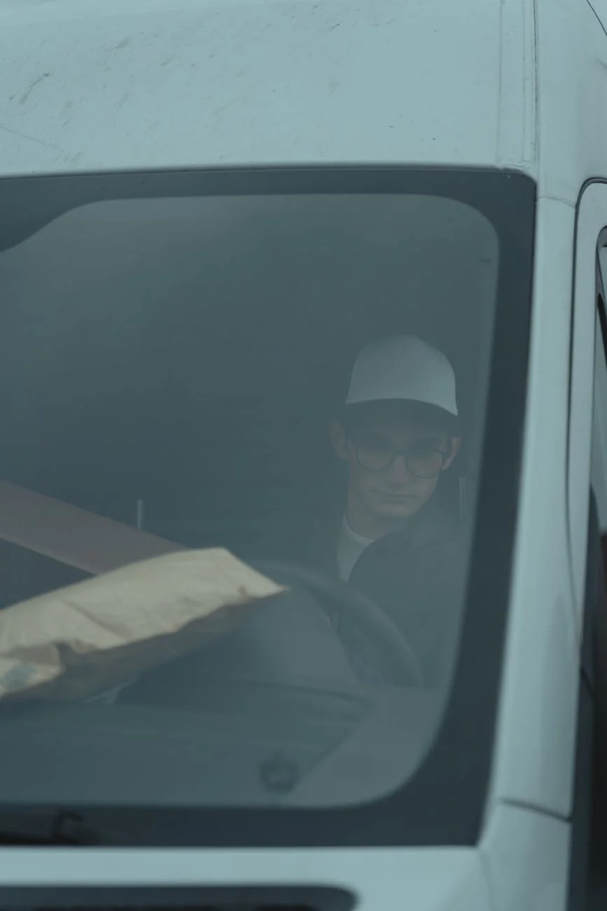 A Delivery Driver In A Van With Parcels 2