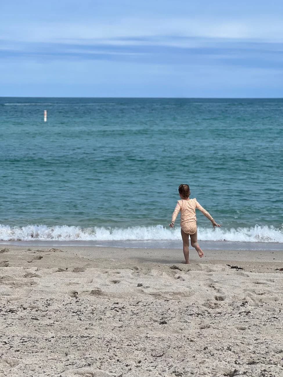 A Young Girl Runs Towards The Ocean Wave 3