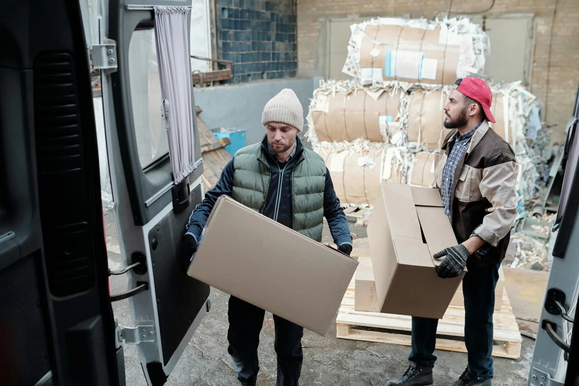 Two Male Workers Loading Cardboard Boxes 1