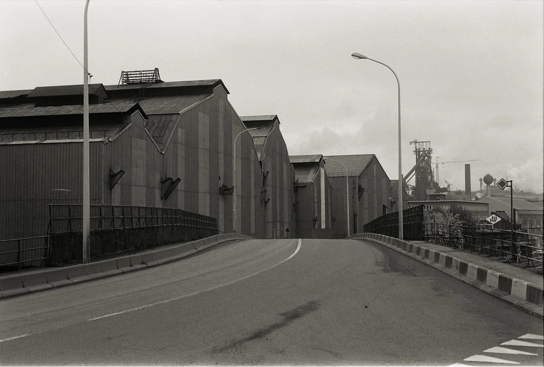 Black And White Photo Of Warehouses In A 1