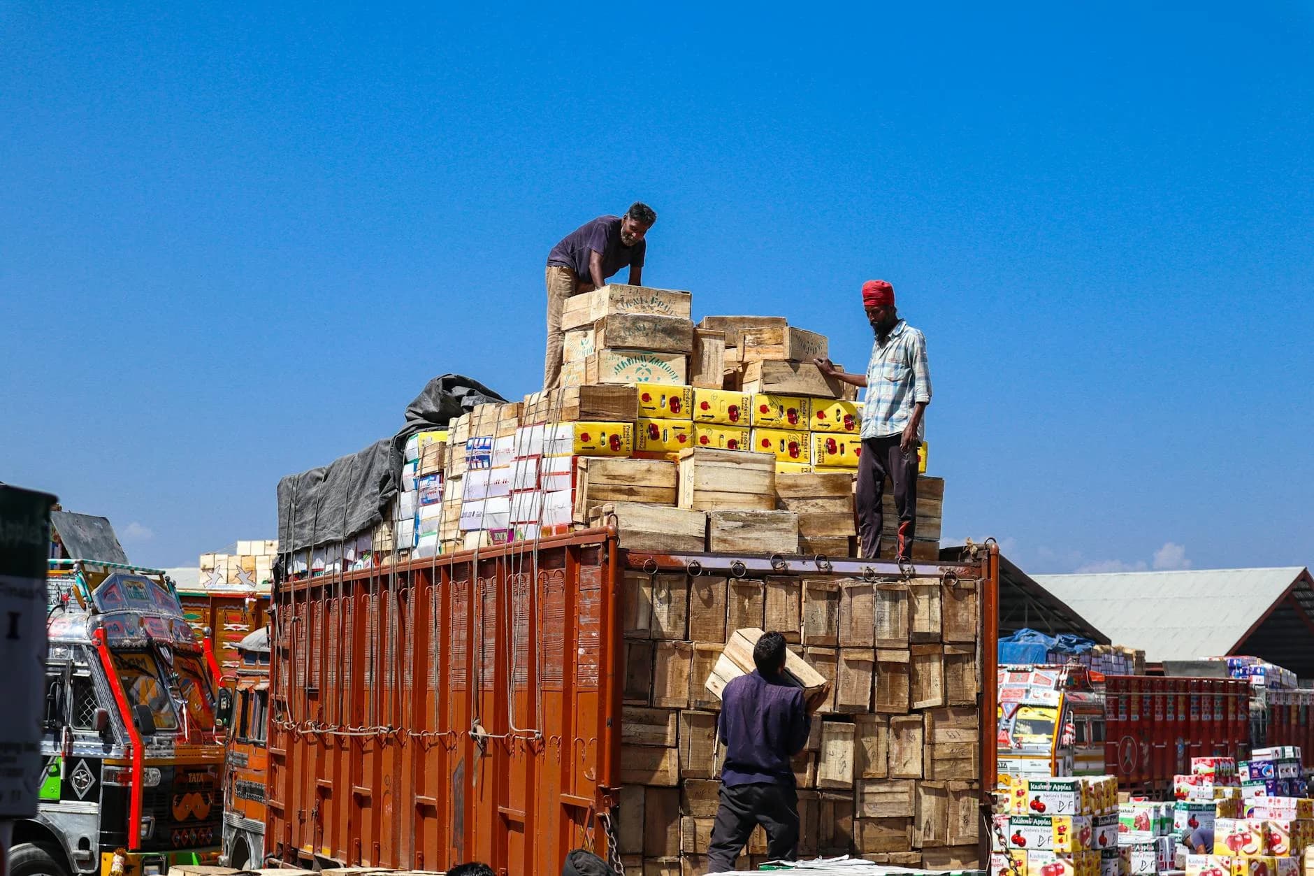Svc Three Men Loading Wooden Boxes On A Truc 2