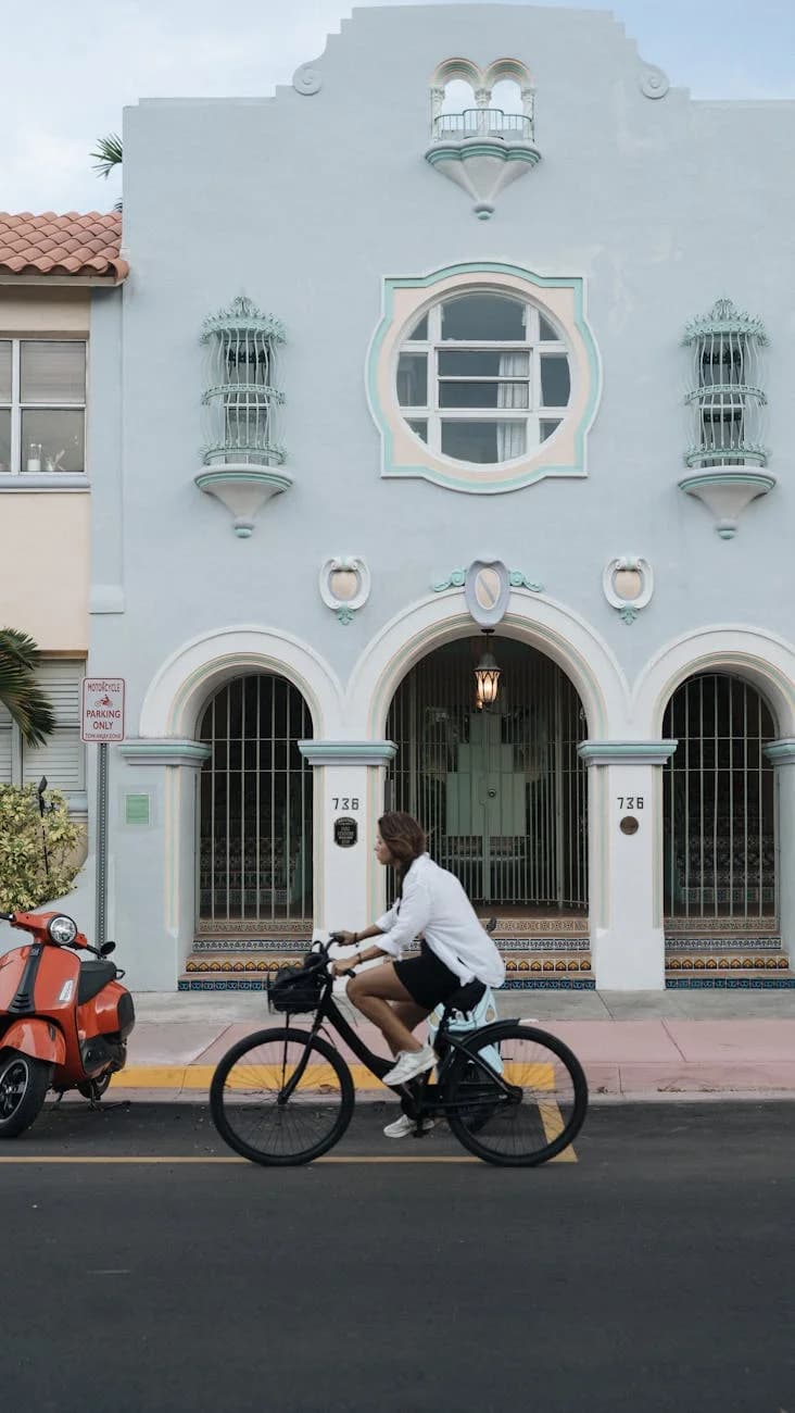 Man Cycling Past Iconic Art Deco Archite 4