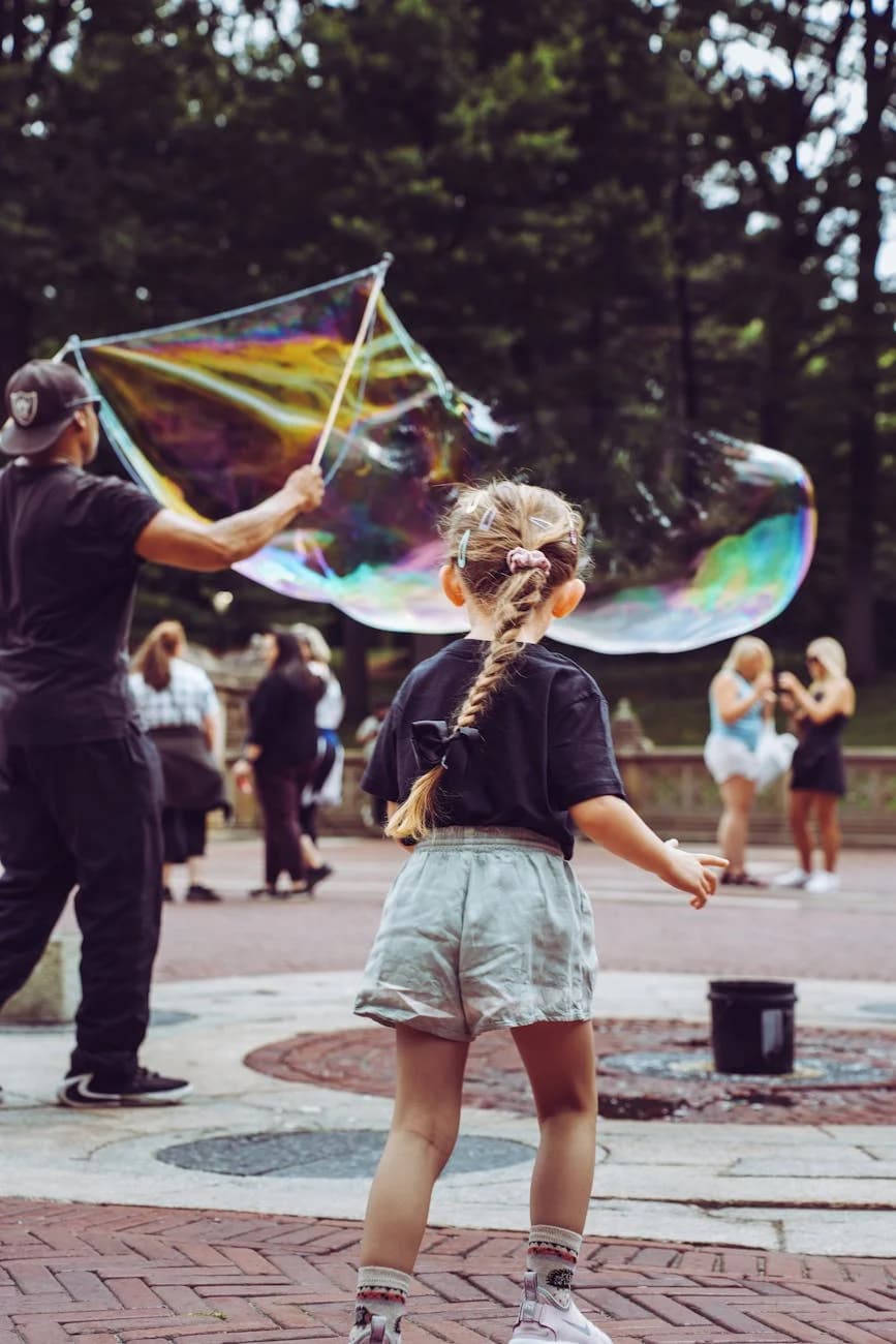 Little Girl Captivated By Giant Bubble A 3