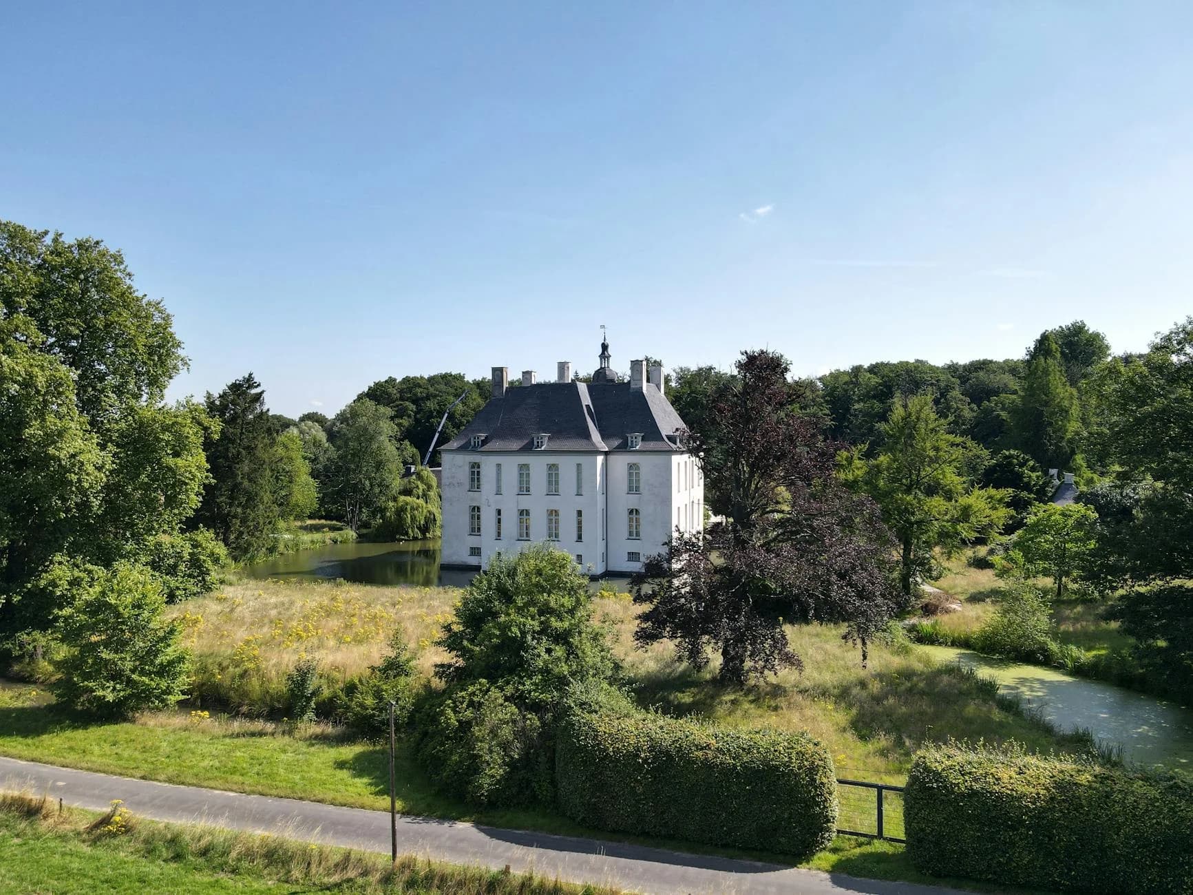 Elegant White Mansion Surrounded By Lush 2