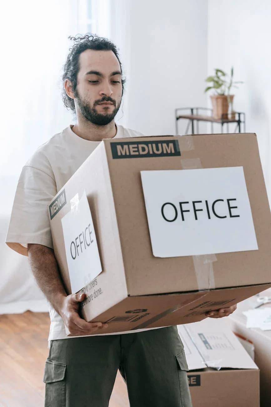 Man Moving Box Labeled Office Indoors Du 1