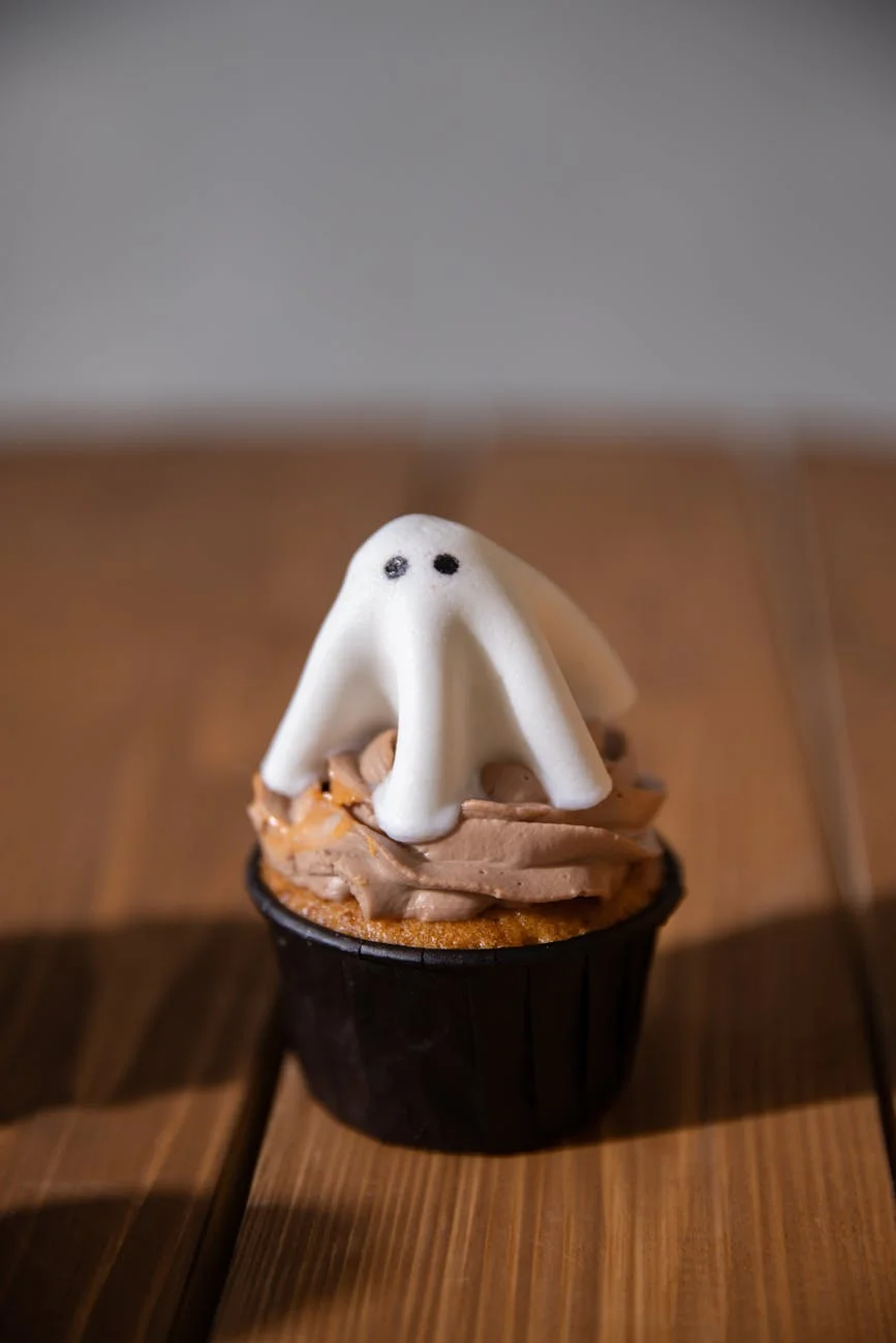 A Cute Halloween Cupcake Topped With Gho 3