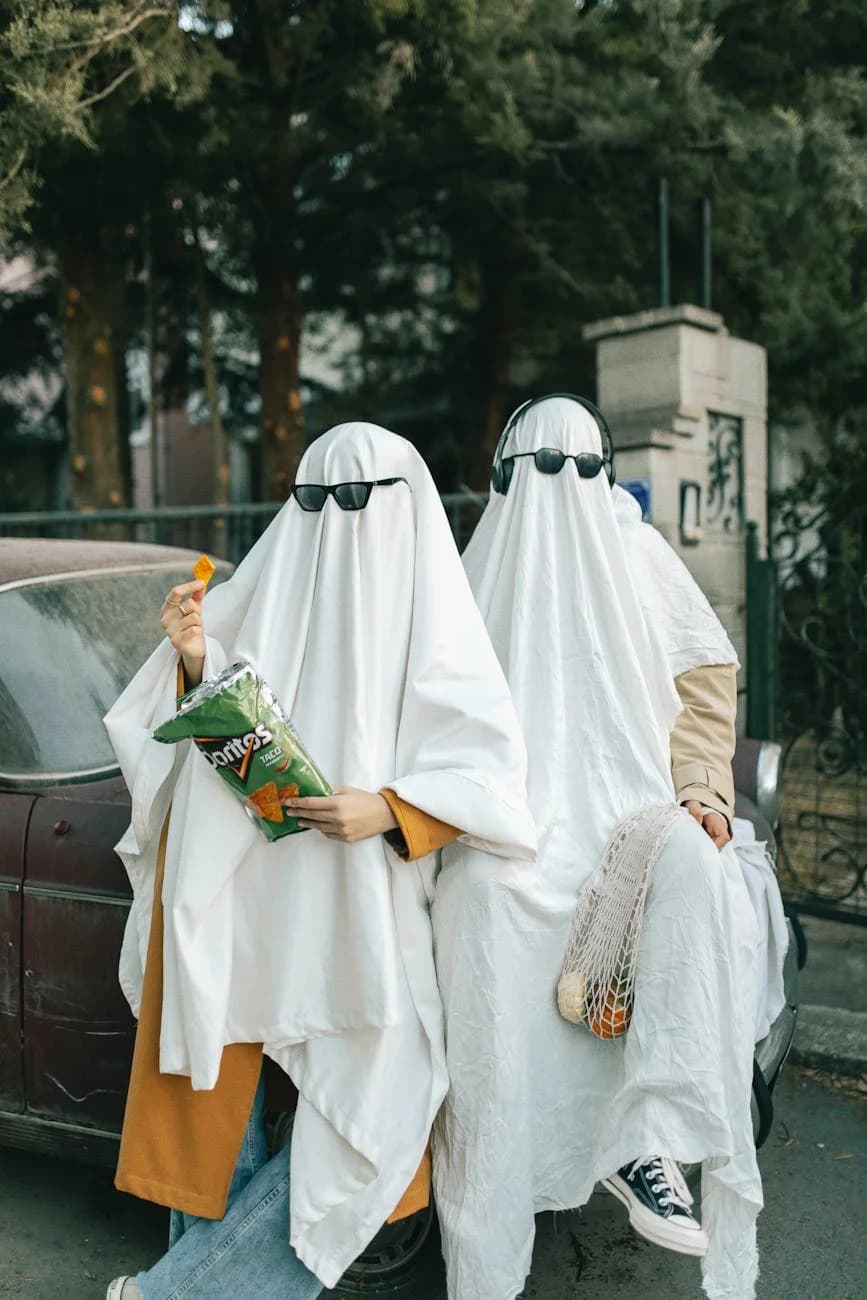 Two People In Ghost Costumes With Sungla 2