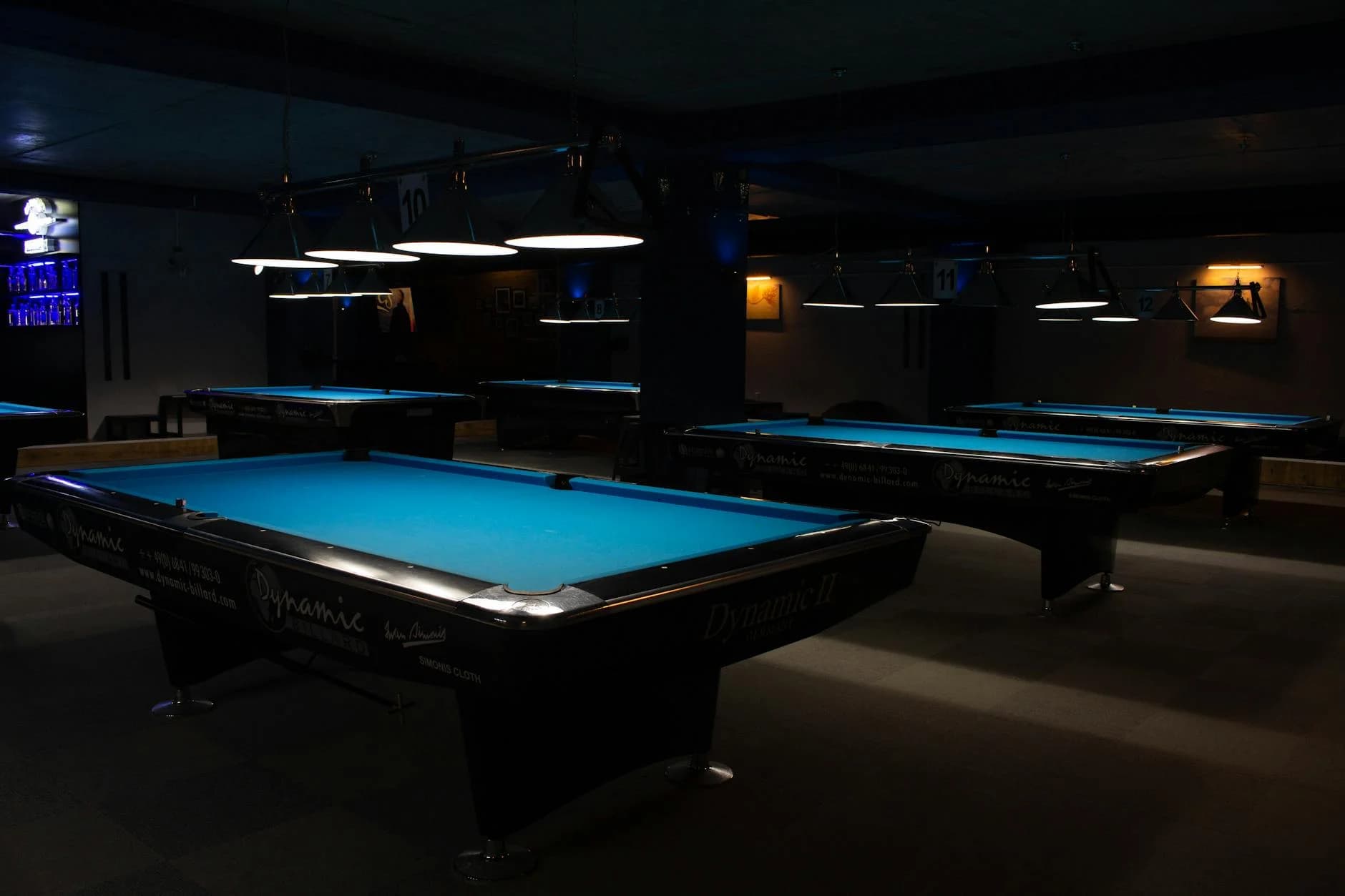 A Row Of Empty Billiard Tables In A Diml 2