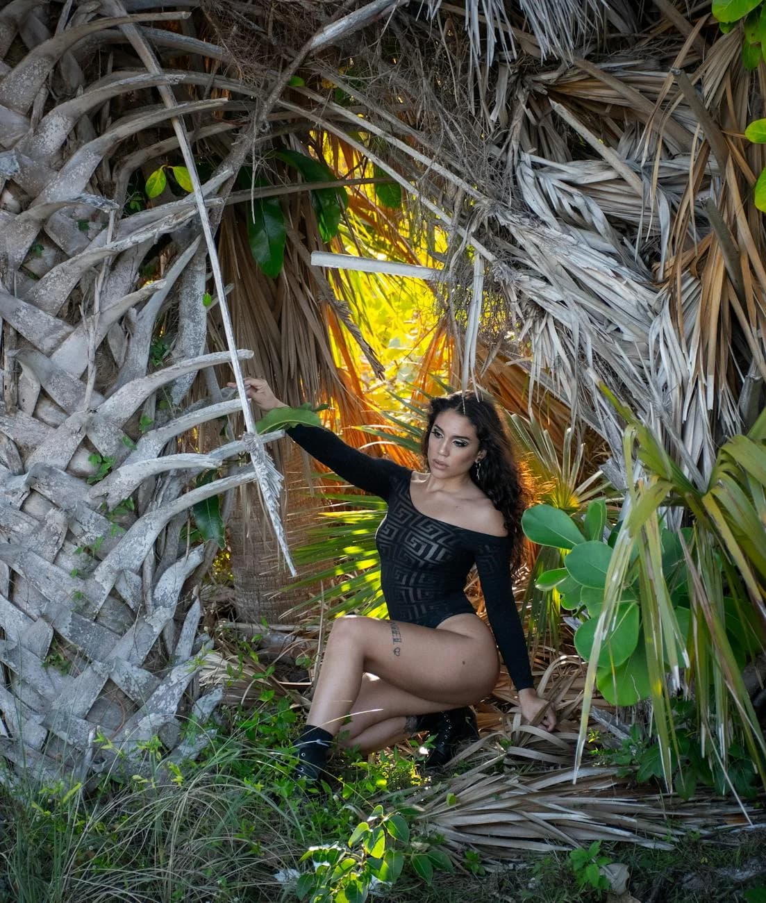 Loc A Woman Poses Amongst Lush Palm Trees In 1