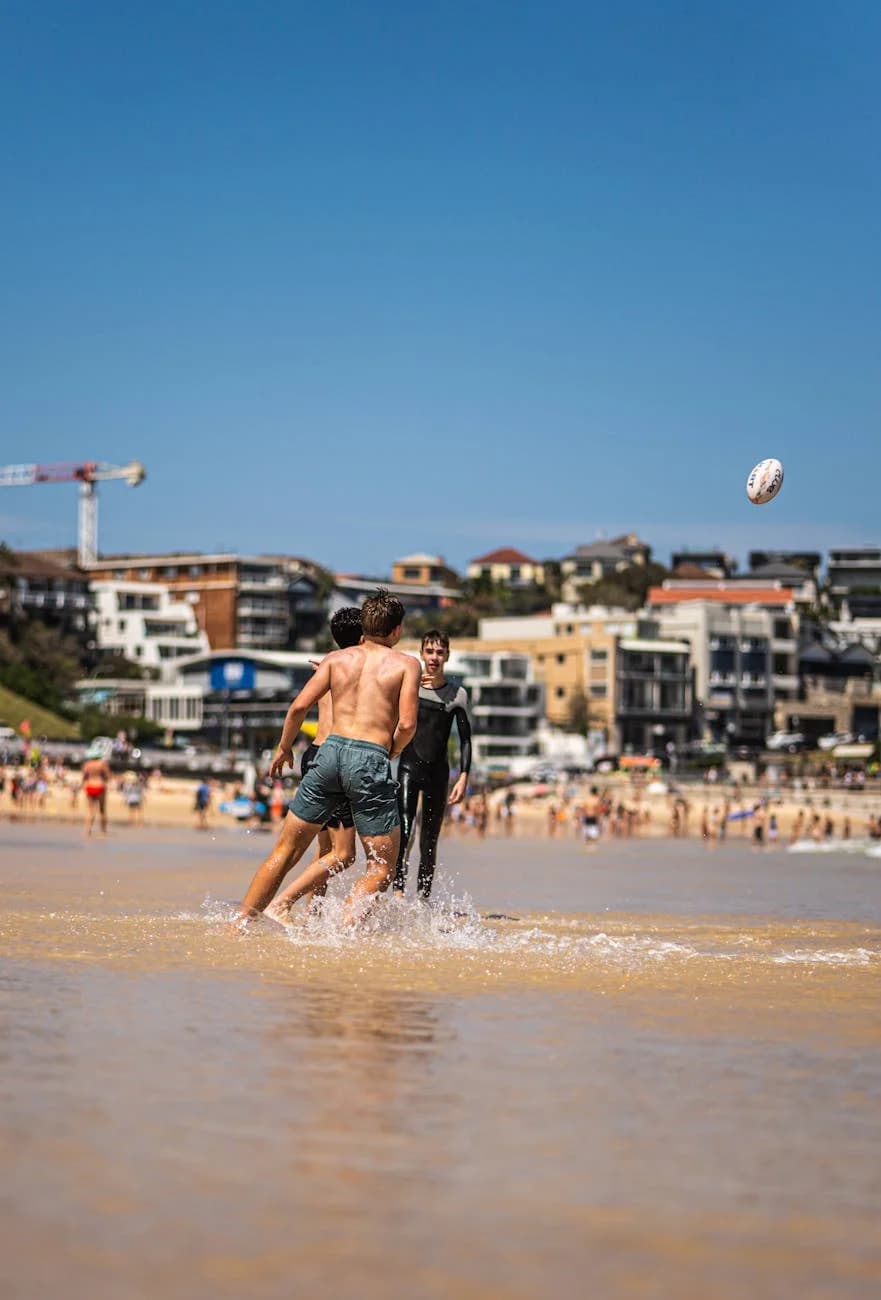 Two Men Playing Beach Rugby In Sydney On 1