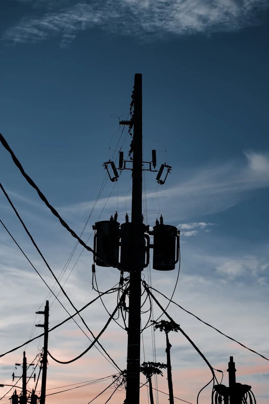 A Powerful Silhouette Of Utility Poles A 4