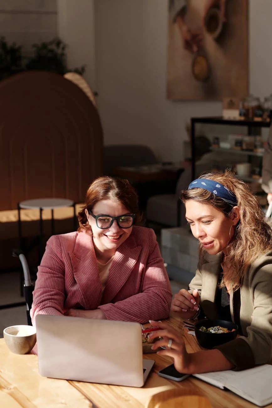 Two Women Collaborating On A Project In 2