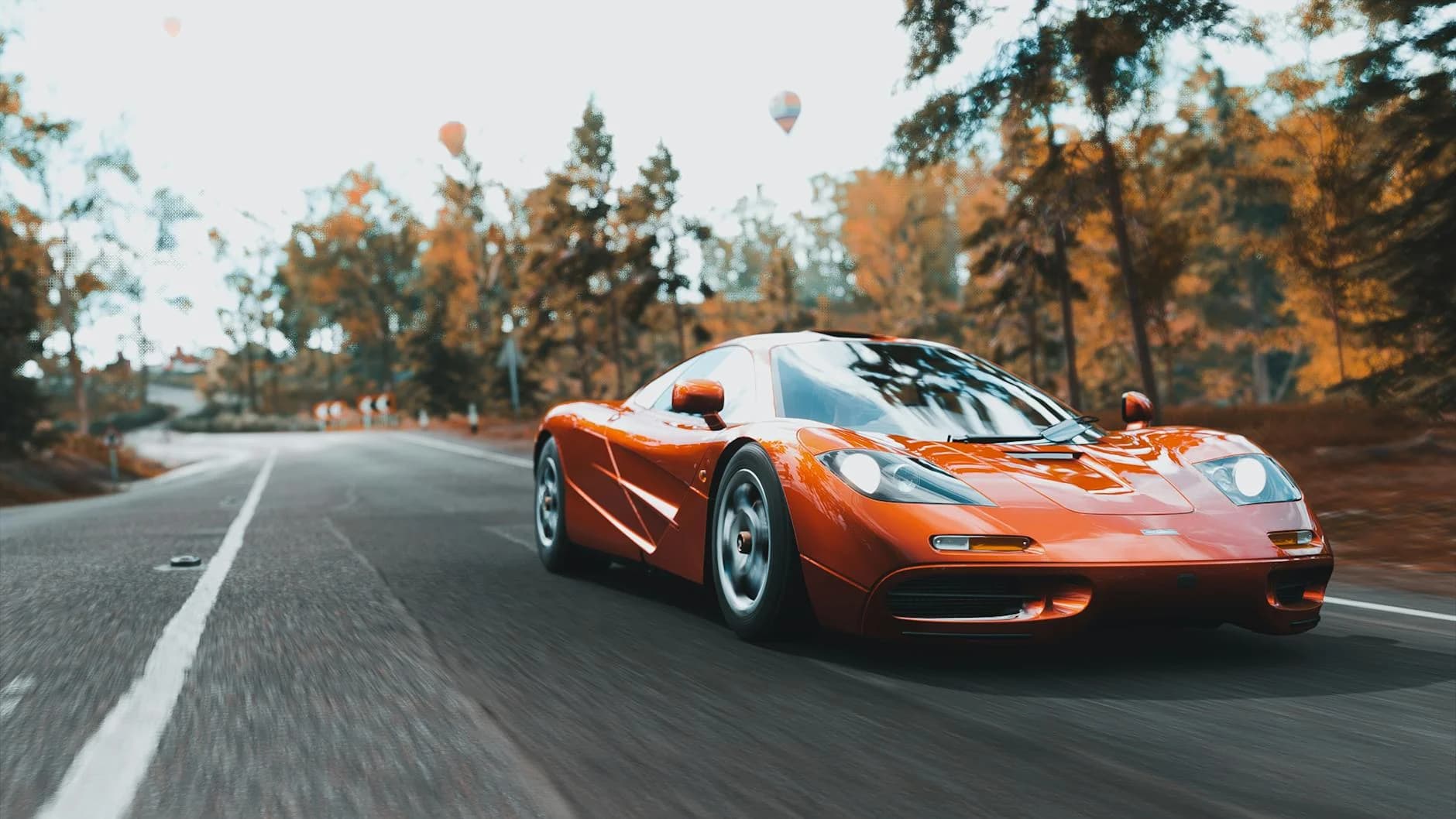 A Red Sports Car Races On A Tree Lined R 2