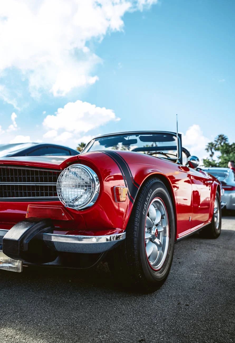 A Vibrant Red Classic Convertible Car Pa 2