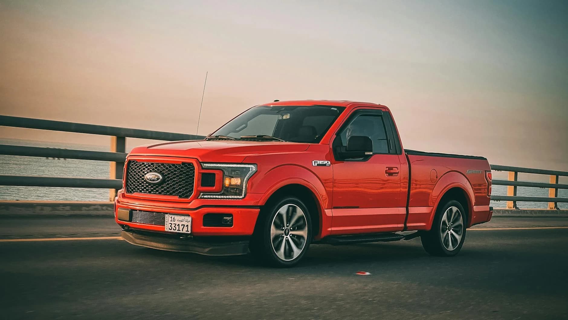 Svc Red Ford F 150 Truck Driving On A Bridge 2