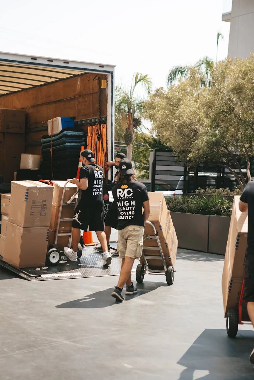 Svc Movers Loading Boxes Into A Truck On A S 3